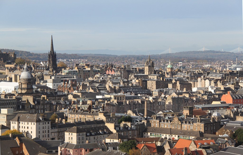View of Old Town from the Crags looking North West with the Forth Bridges in the distance.
