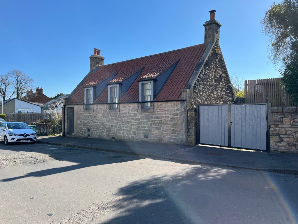 Restored Pantile Cottage on Ravenscroft St, Gilmerton on a sunny day